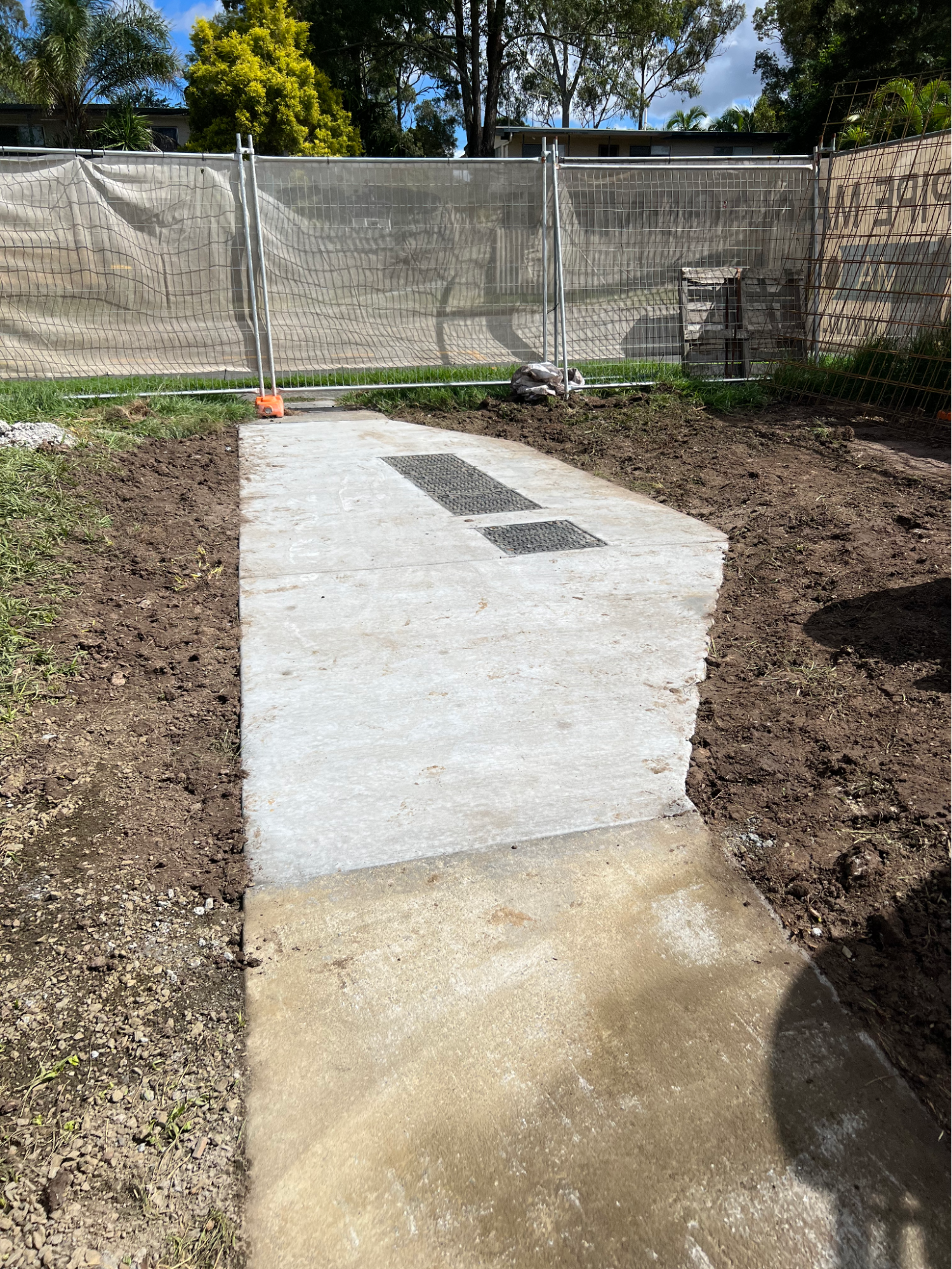 Reinstated site with turf and compliant access covers