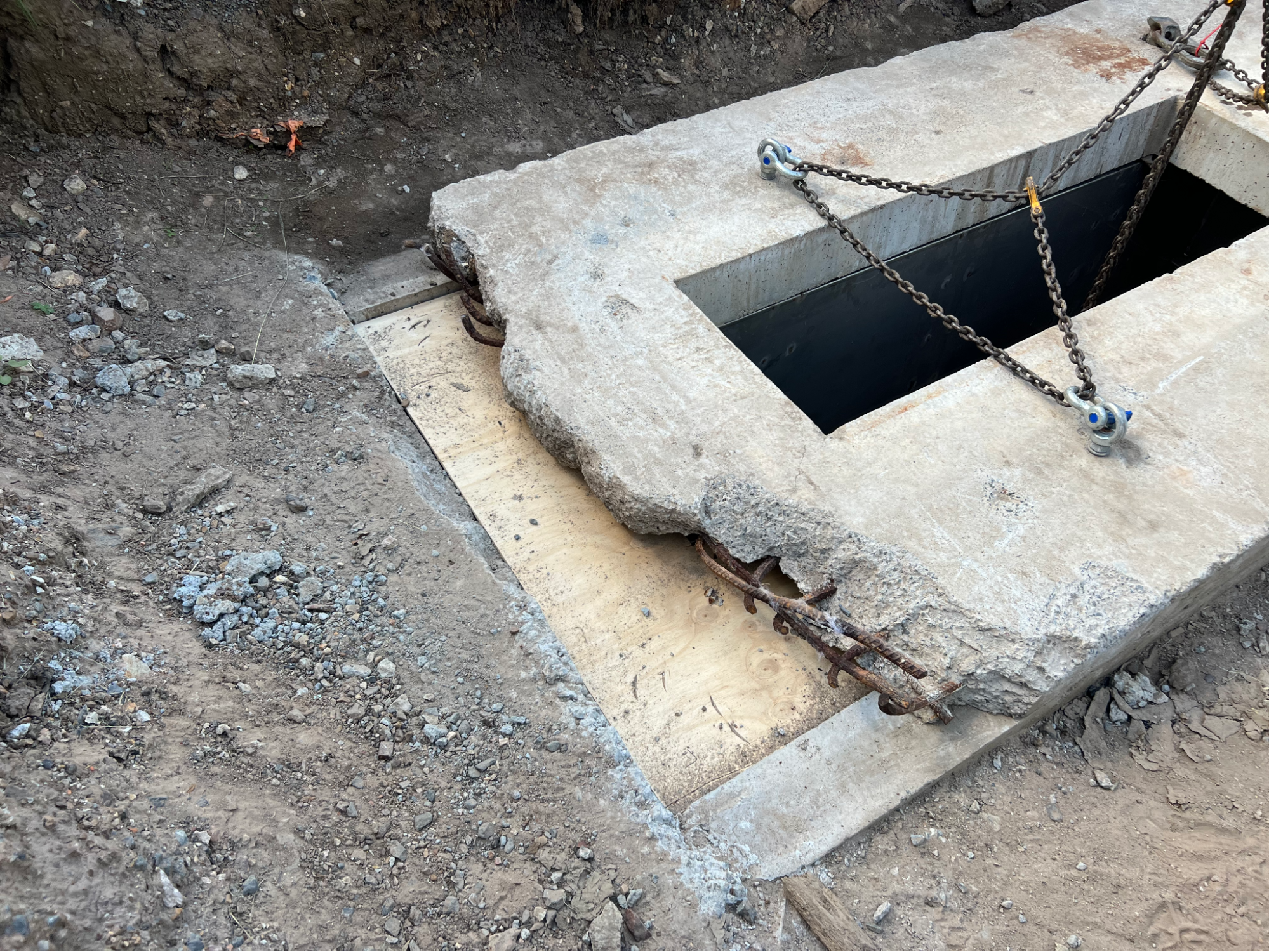 Cover slab lifted out to expose the chamber