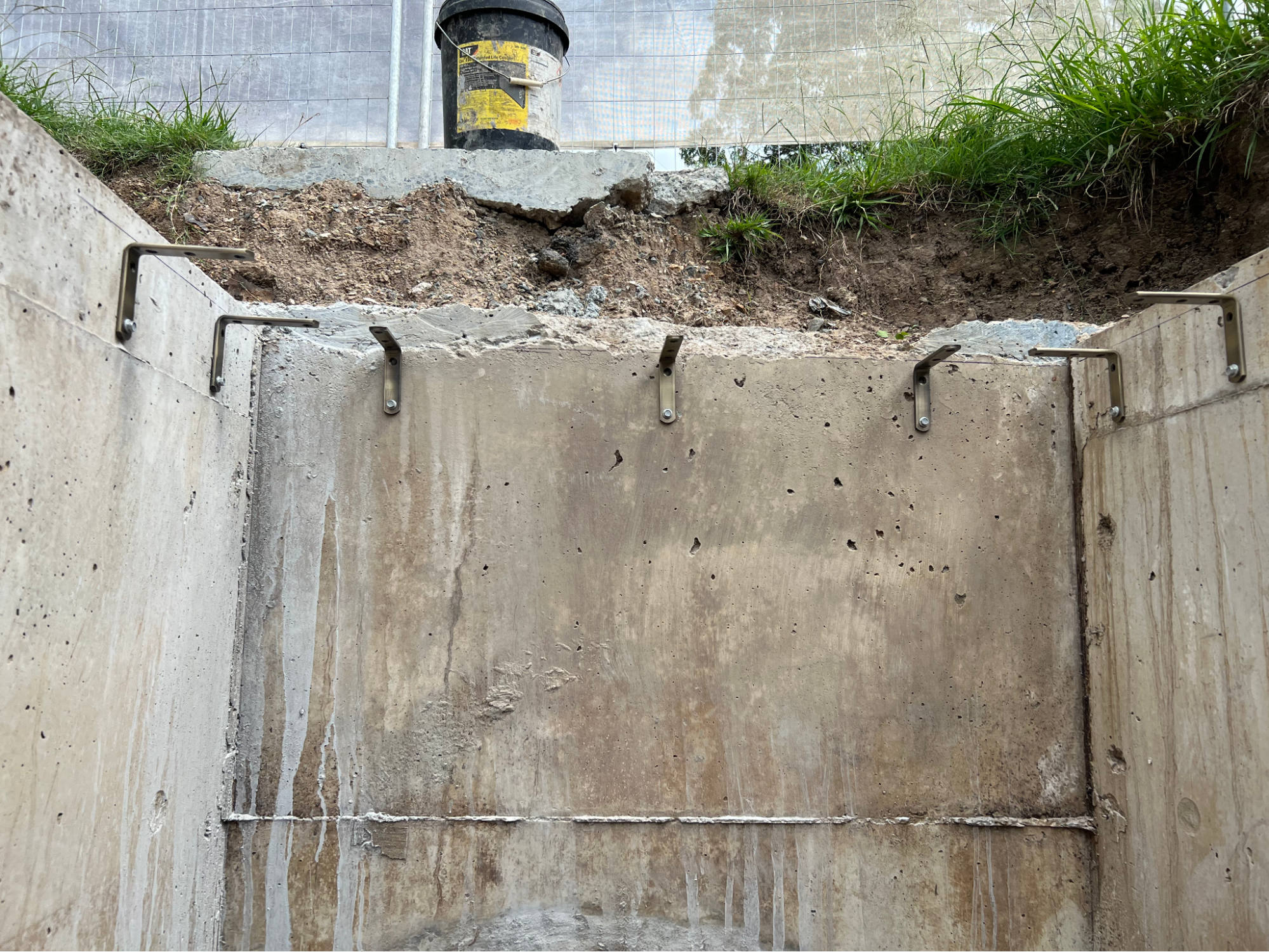Structural support brackets fitted to the chamber walls